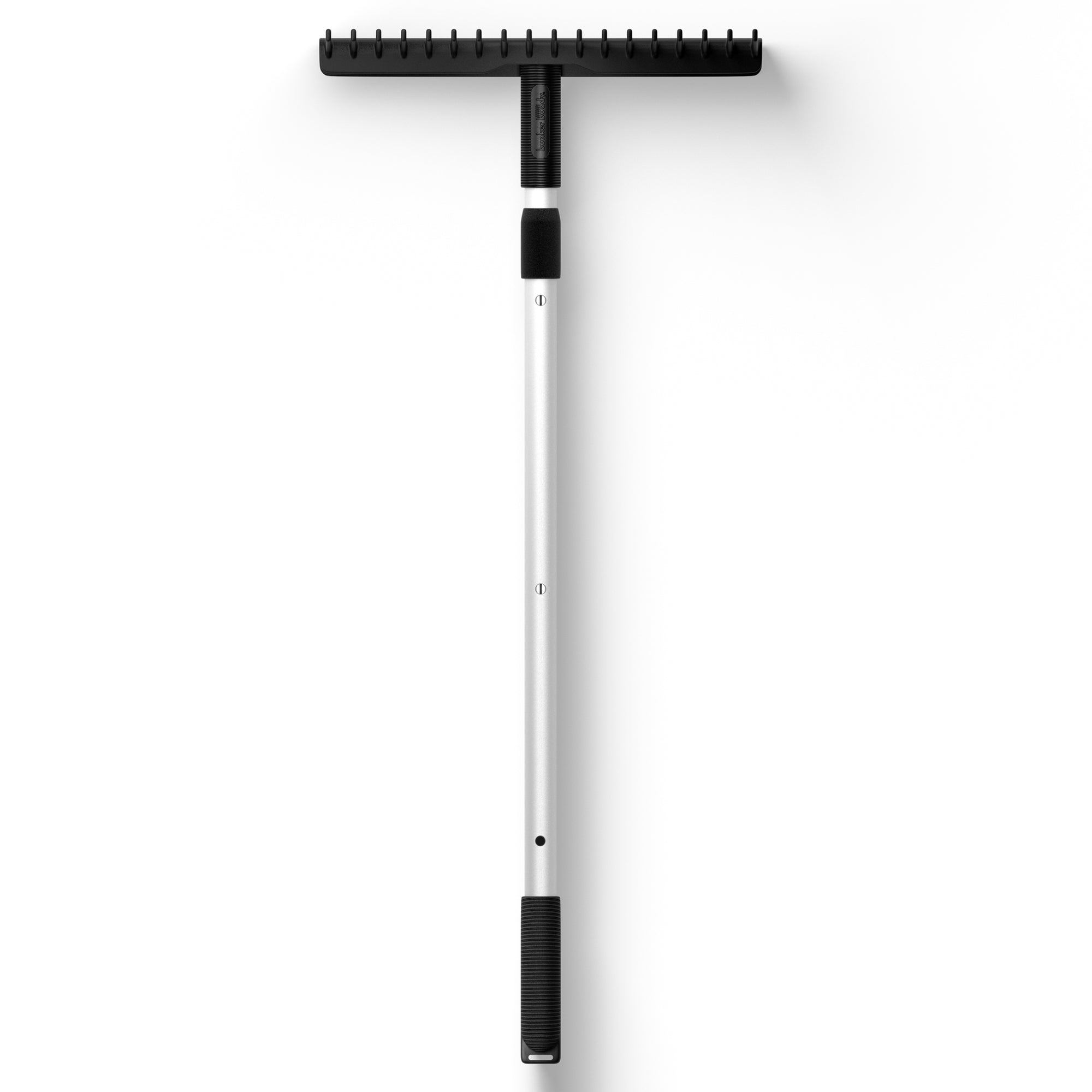 Bunker Buddy Golf Rake on white background. Black handle with satin metal pole and black rake head.